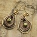 Multicolored metal earrings with copper, German silver and brass hoops with green Swarovski pearls