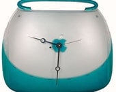 TEcoArt's iClock is a former Apple iBook Blueberry Clamshell Laptop recycled as one, Unique Clock.