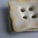 square ceramic buttons in creamy orange