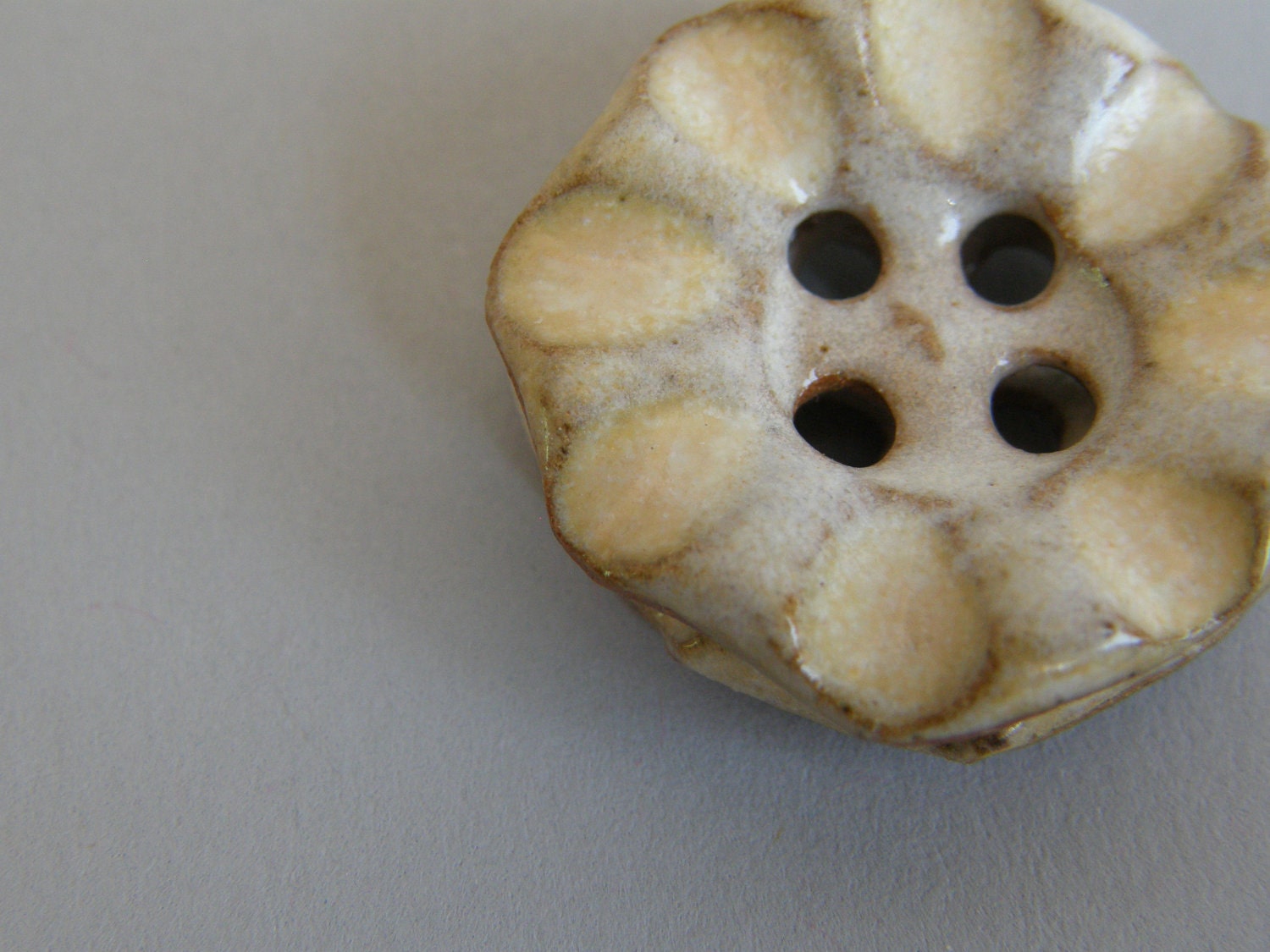 handmade ceramic buttons in light creamy white with a hint of orange