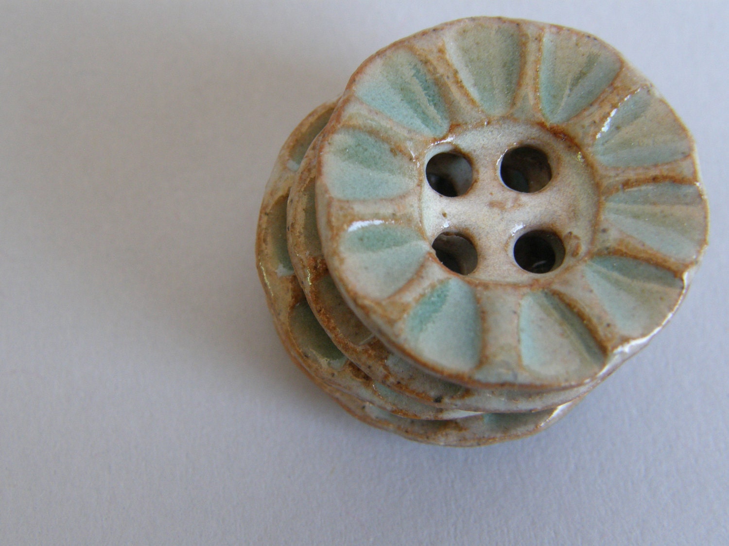 ceramic buttons in light green and creamy white