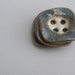 square textured buttons in slate blue and creamy white