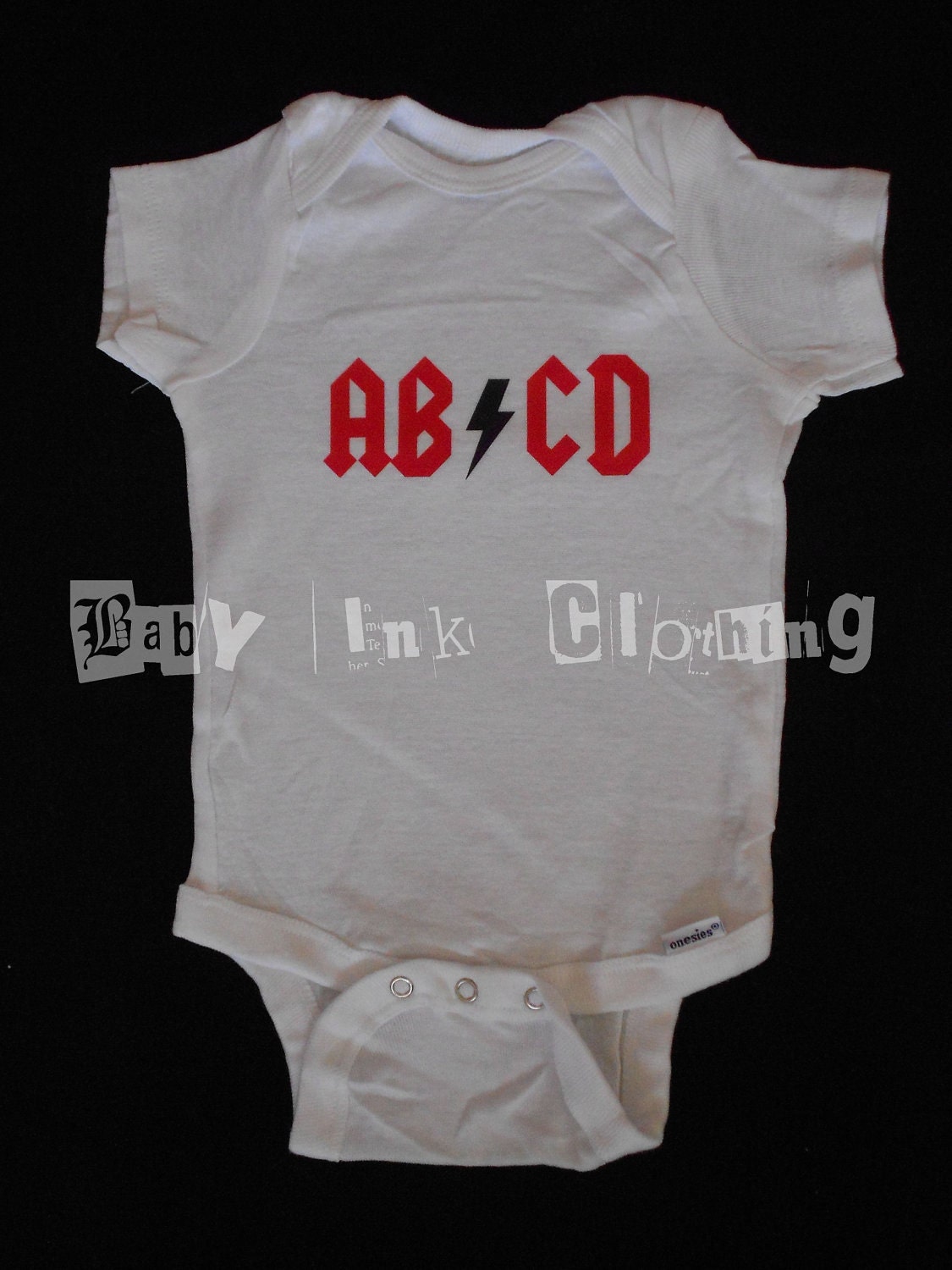 AB/CD onesie