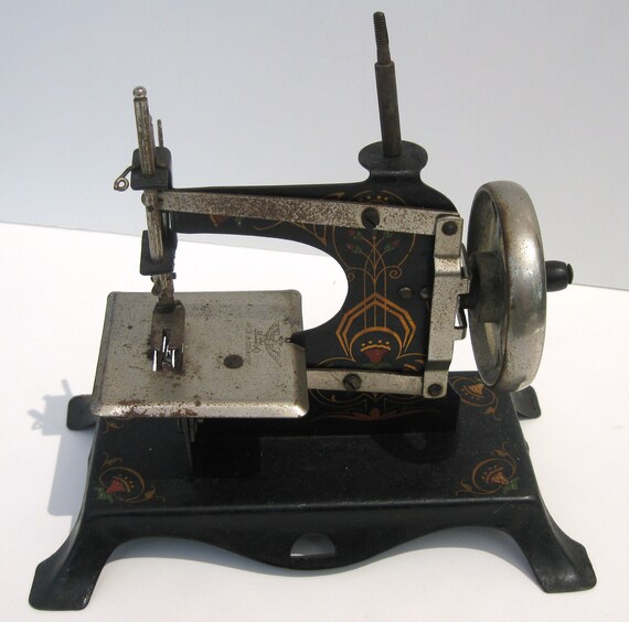 Items similar to Antique Toy Sewing Machine West Germany on Etsy