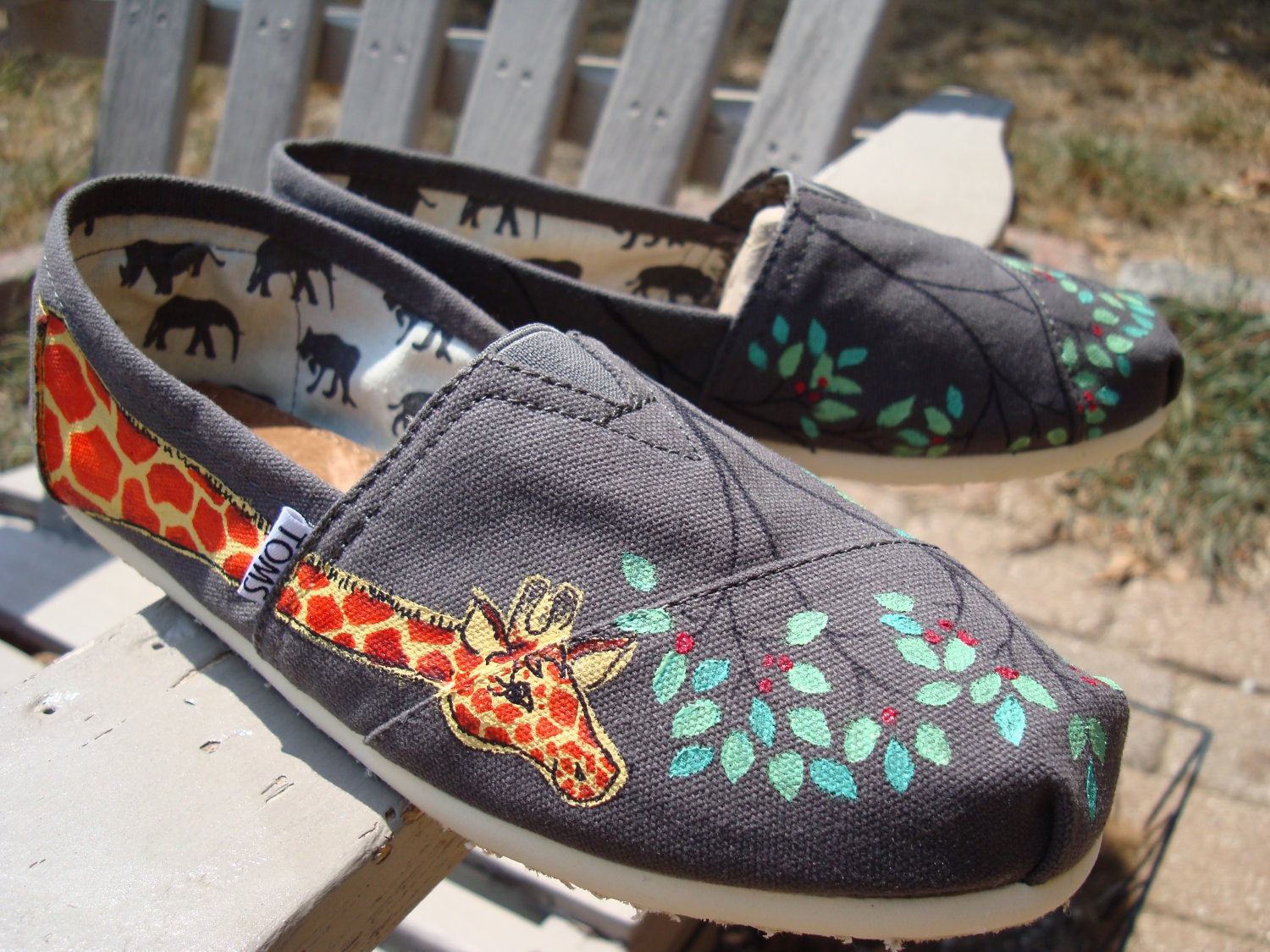 giraffes painted on TOMS shoes