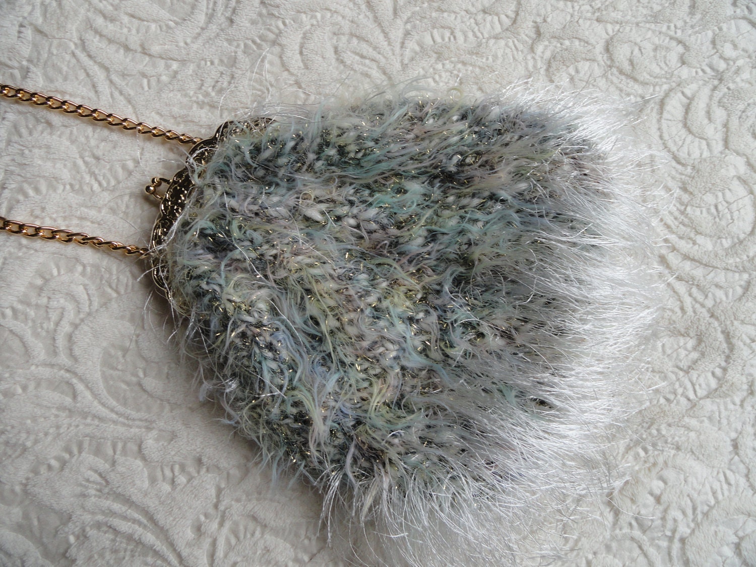 Hand knitted purse or bag, modern opera bag, eye lash yarn,  mohair yarn