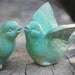 Bird wedding cake toppers in mint green love birds in a wedding dance