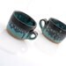 ceramic mugs in black and turquoise set of two