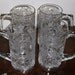 Four Poinsettia Embossed Glass Mugs