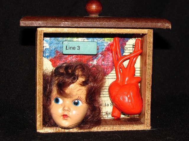 unrequited on line 3, a shadow box made from found objects