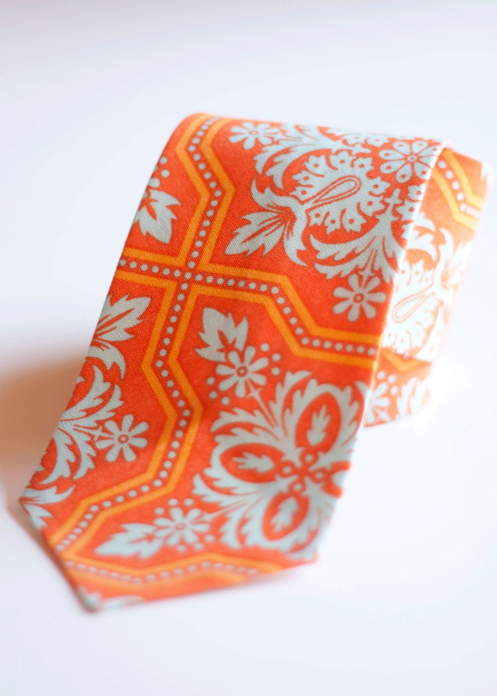 The Beau- men's tile flourish in amber necktie- citrine collection