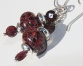 Deep red artisan lampwork earrings with garnet and hand forged sterling silver
