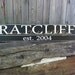 Personalized wood sign made with last name, first names of entire family and year of wedding
