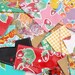 One Dozen Assorted Oilcloth Coupon/Receipt Wallets