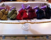 Breakfast at Tiffany's Holly Golightly inspired tassel earplugs.  Charm ear plugs.  Follow your heart.  HANDMADE.
