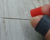Needle Grabber tool for needleworkers - wearable pliers