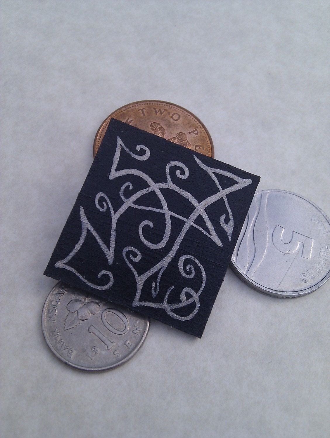 Silver & black brooch