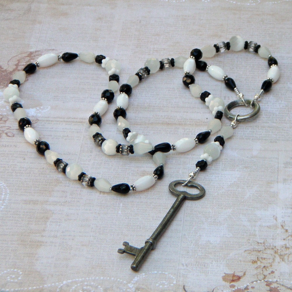 Long Beaded Rosary Style Black and White Necklace with an Antique Key Pendant