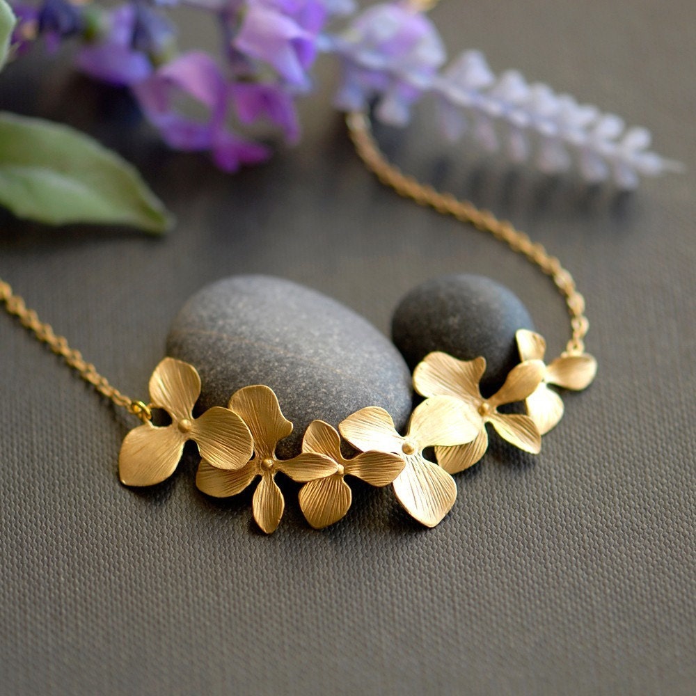 A girl who loves orchids . Gold filled chain
