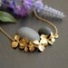 A girl who loves orchids . Gold filled chain