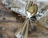 five vintage teaspoons