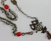 Old World Necklace Featuring a Brass Victorian Escutcheon and Vintage Rosaries