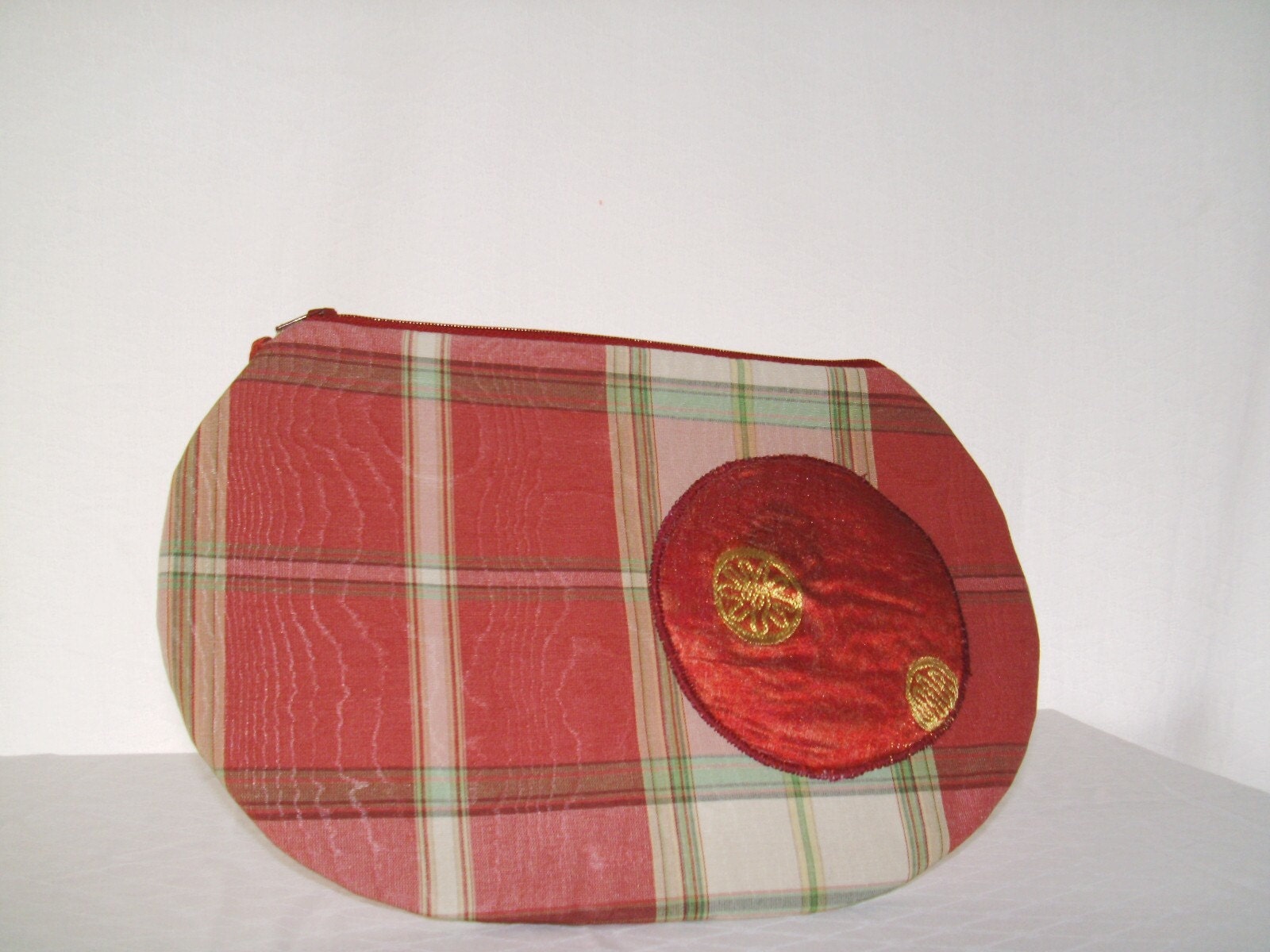 OUR CURVED CLUTCH IN BRIGHT COLORED RECLAIMED FABRIC
