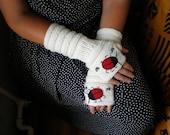 Hand-knitted white wrist warmers with hand needlecrafted ladybird