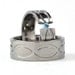 New Infinity His and Hers Tension Set Titanium Wedding Rings