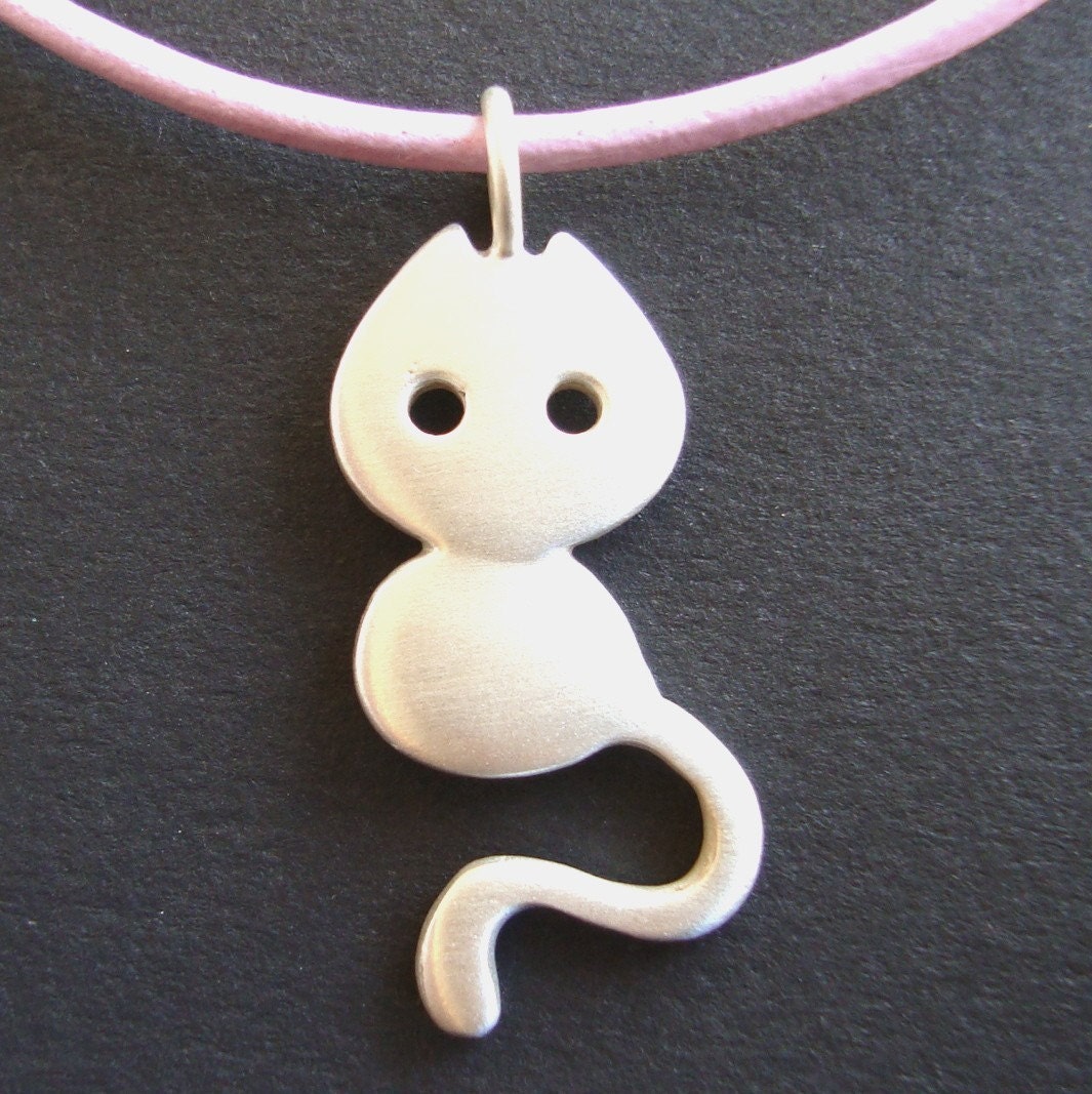Little cat with leather cord
