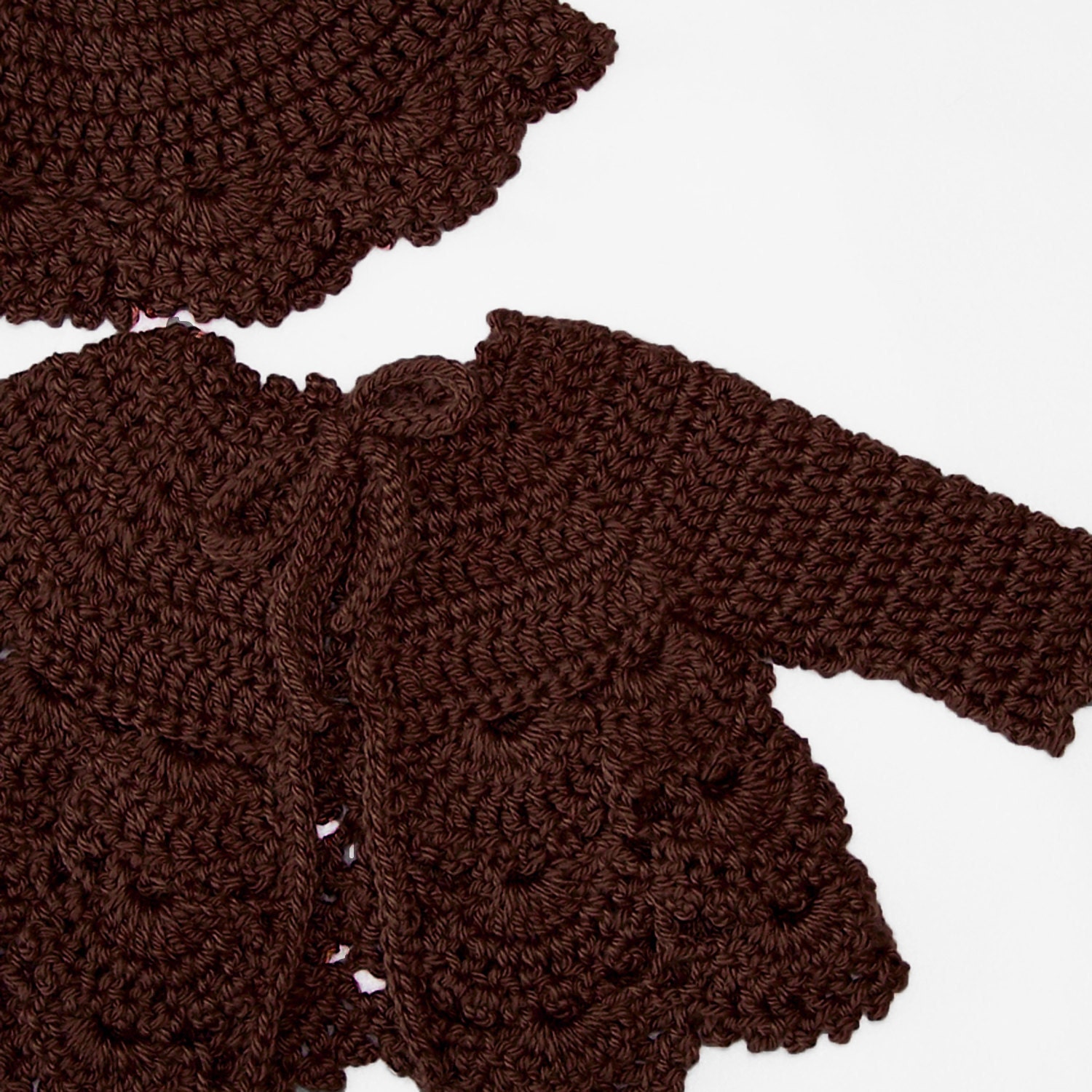 Crochet baby sweater in a soft wool blend yarn in Chocolate brown