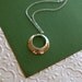 Sterling silver hammered disc pendant necklace