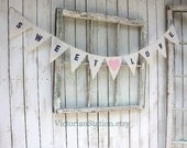 Sweet Love banner with navy blue font and pink fabric heart