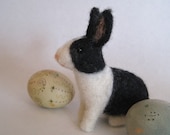 A bunny in black and white, needle felted rabbit animal sculpture