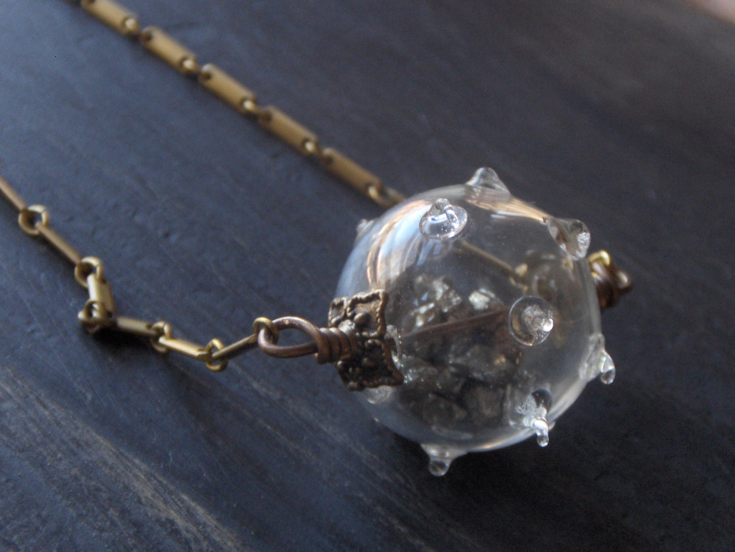 The Briny Deep. Urchin- Cephalopod like handblown glass bauble filled with Pyrite (fools gold ) nuggets