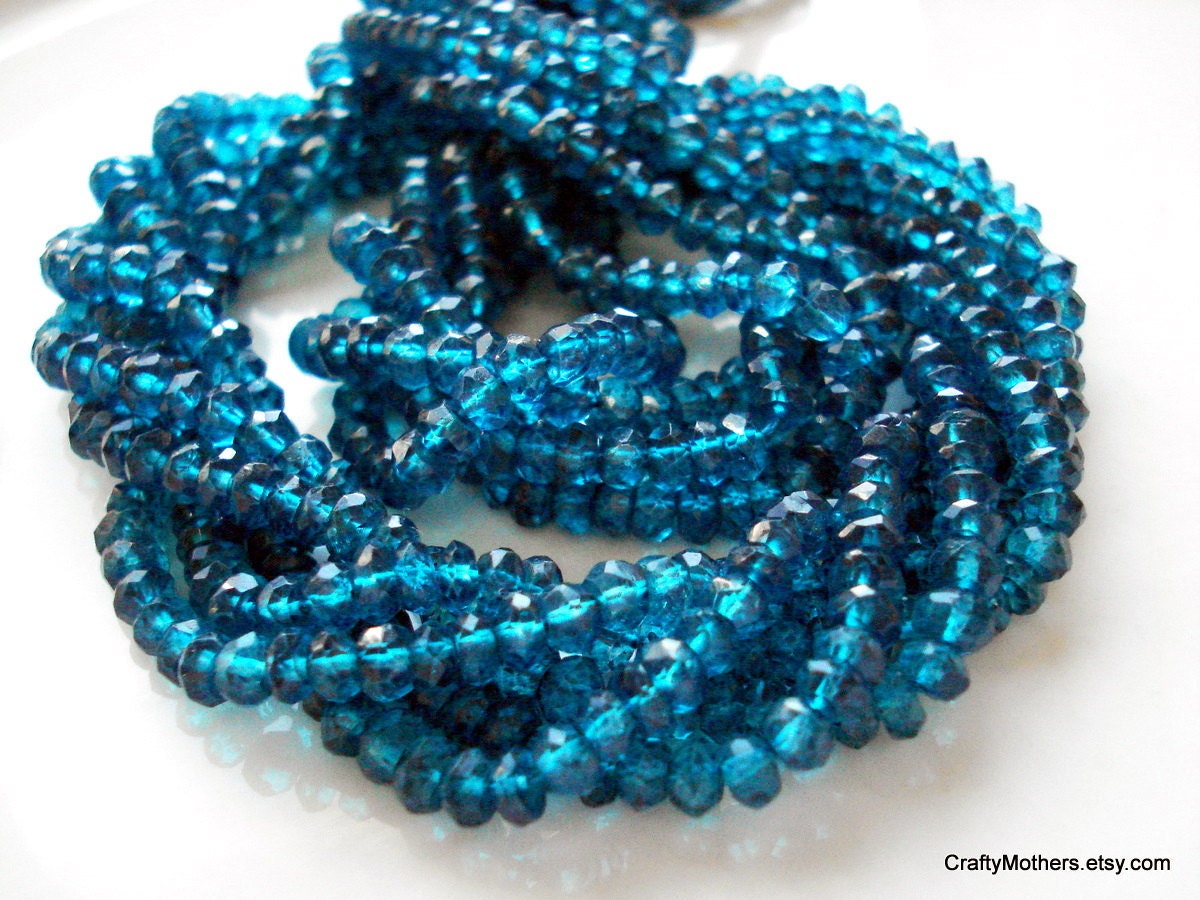 CLEARANCE - London Blue Mystic Quartz Faceted Rondelles - 1/4 Strand