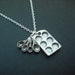 muffin pan and measuring spoon necklace