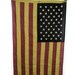Old American flag on salvaged red horse yoke