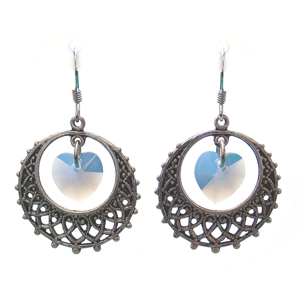 Blue Crystal Heart Earrings... a light blue swarovski crystal heart cradled within an open circle oxidized silver filigree