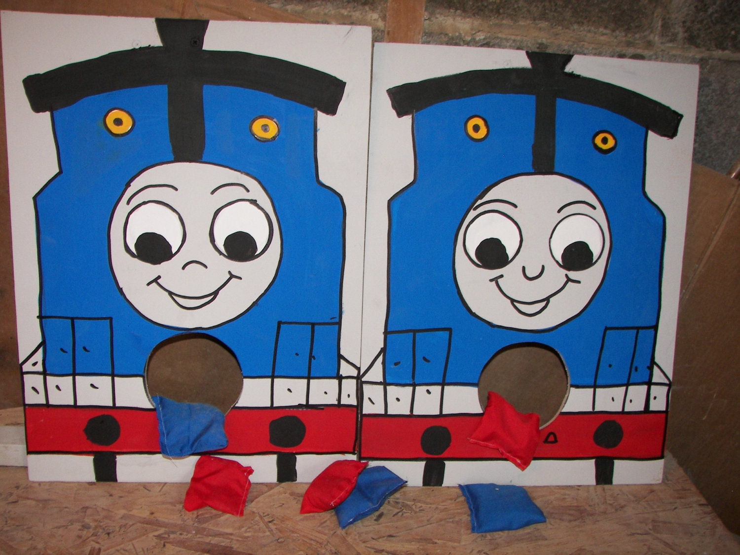 Two  Thomas  corn hole   toss  games with 6 bean bags