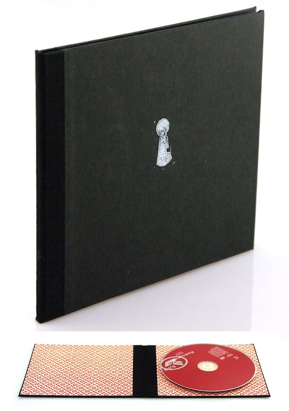 Can you keep a secret - black cd cover with keyhole print