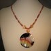 Whimsycle Capiz Shell Medallion Red And Gold Necklace with Child Blowing Bubbles