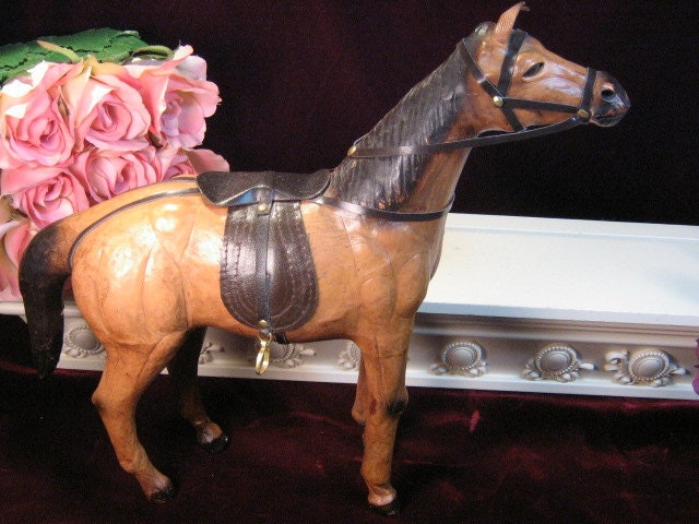 antique leather horse figurine