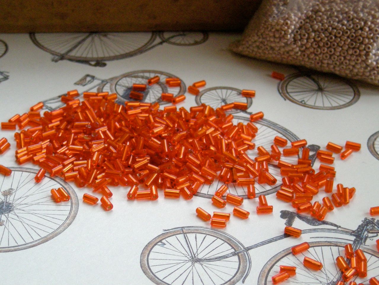 vintage Czech bugle beads, orange, silver lined, 10g