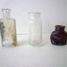 Bottle Lot of 3 Two Clear and one Brown little slightly melted