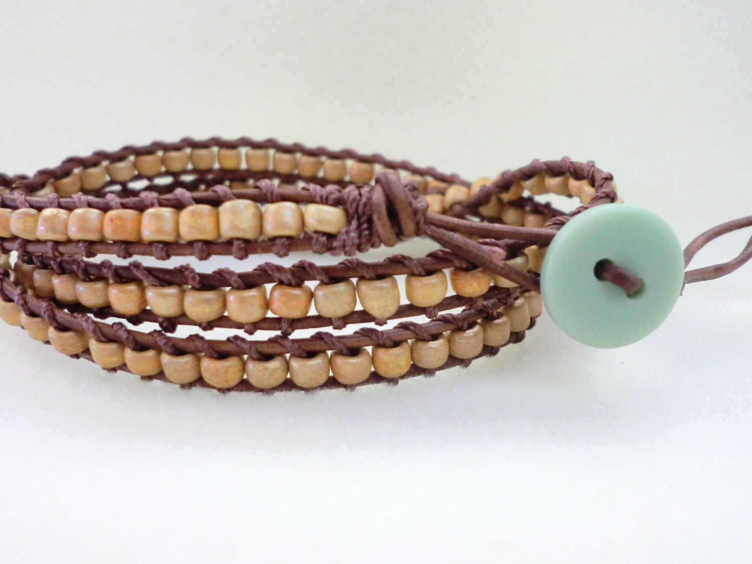 WrapLet, Unisex Honey Brown Japanese Seed Beads on Distressed Brown leather.