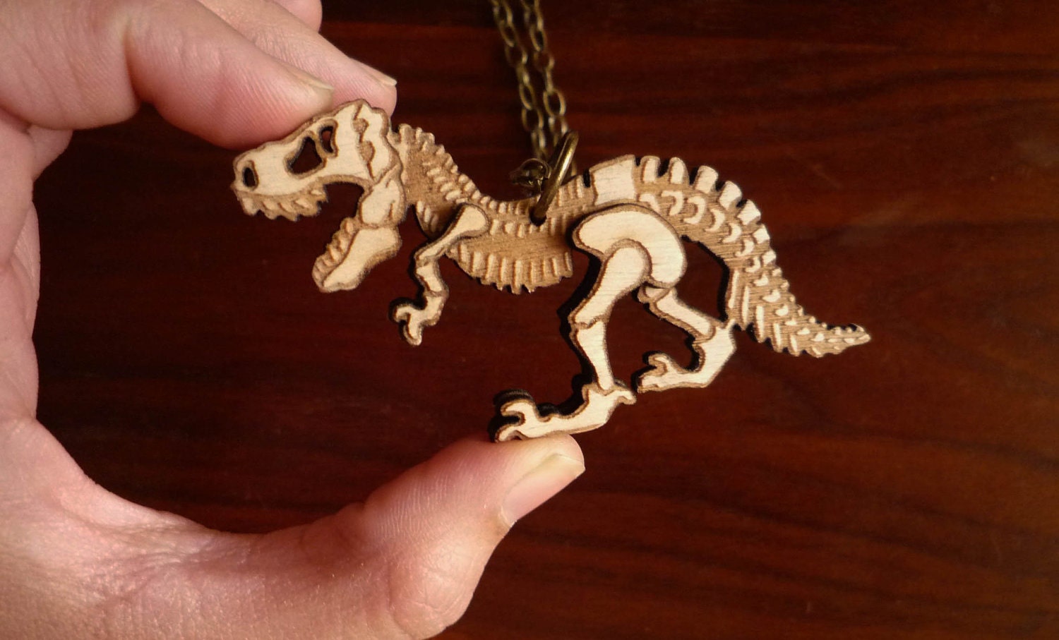 Dinosaur Necklace by Vectorcloud