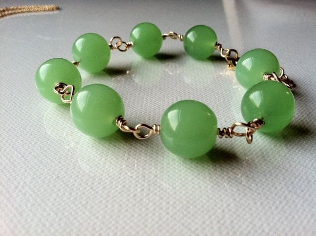 Jewelry Handmade pendant bracelet earring set  Green glass beads wrapped in gold color wire. This is a beautiful set in unique color. 