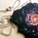 spiral galaxy star formation space bright colorful rainbow necklace M74