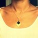 wild thing- black and gold Triangle drop with golden chain